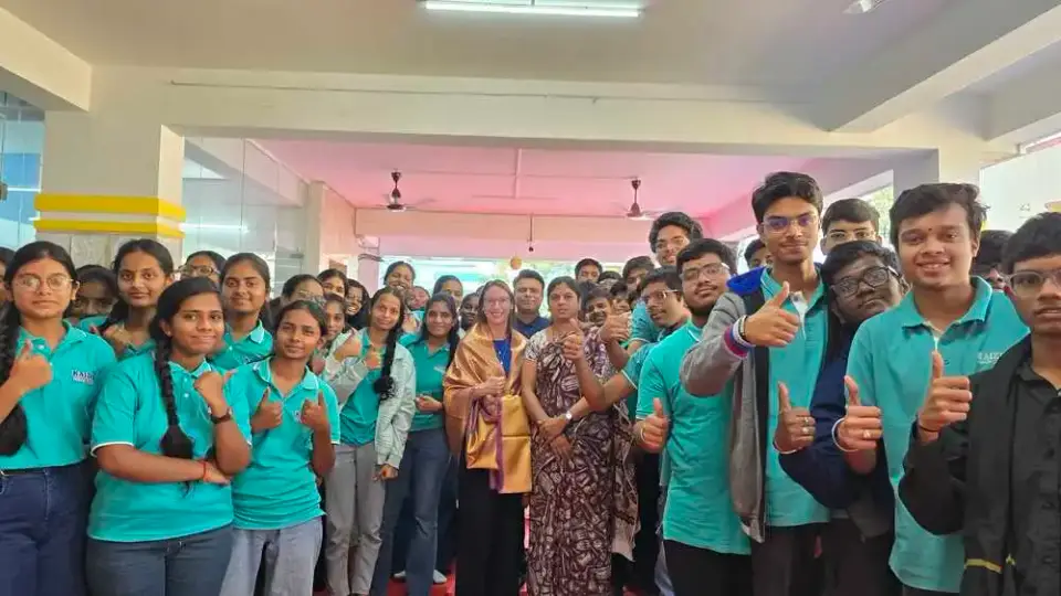 Kaizen students in college uniform giving a thumbs-up in class