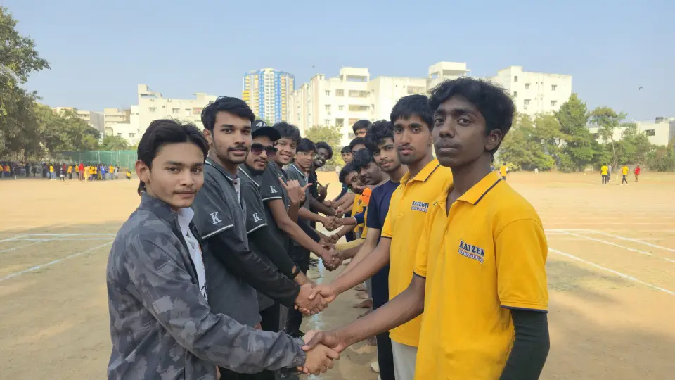 Students shaking hands on the sports ground before a match