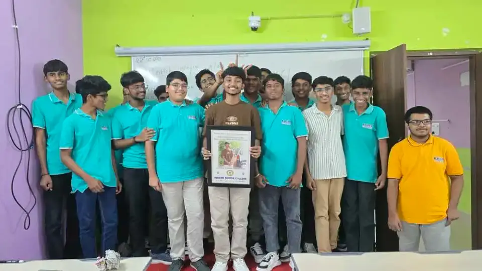 Students presenting a framed portrait in the classroom